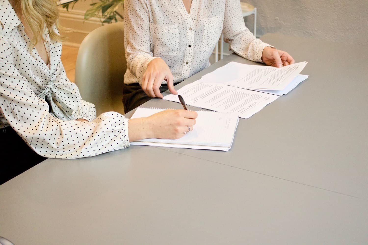 woman signing non-disclosure agreement
