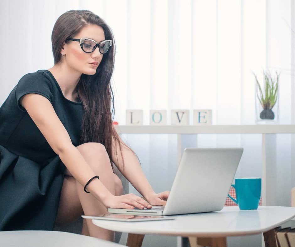 woman working on a laptop - Jobs Where You Work Alone (Best Jobs for Introverts)